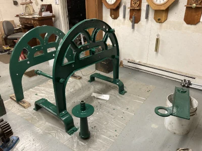 Workshop bench with tower clock parts laid out during the Moffat Library restoration.